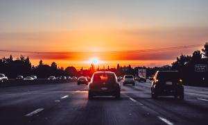 A sunset over a highway